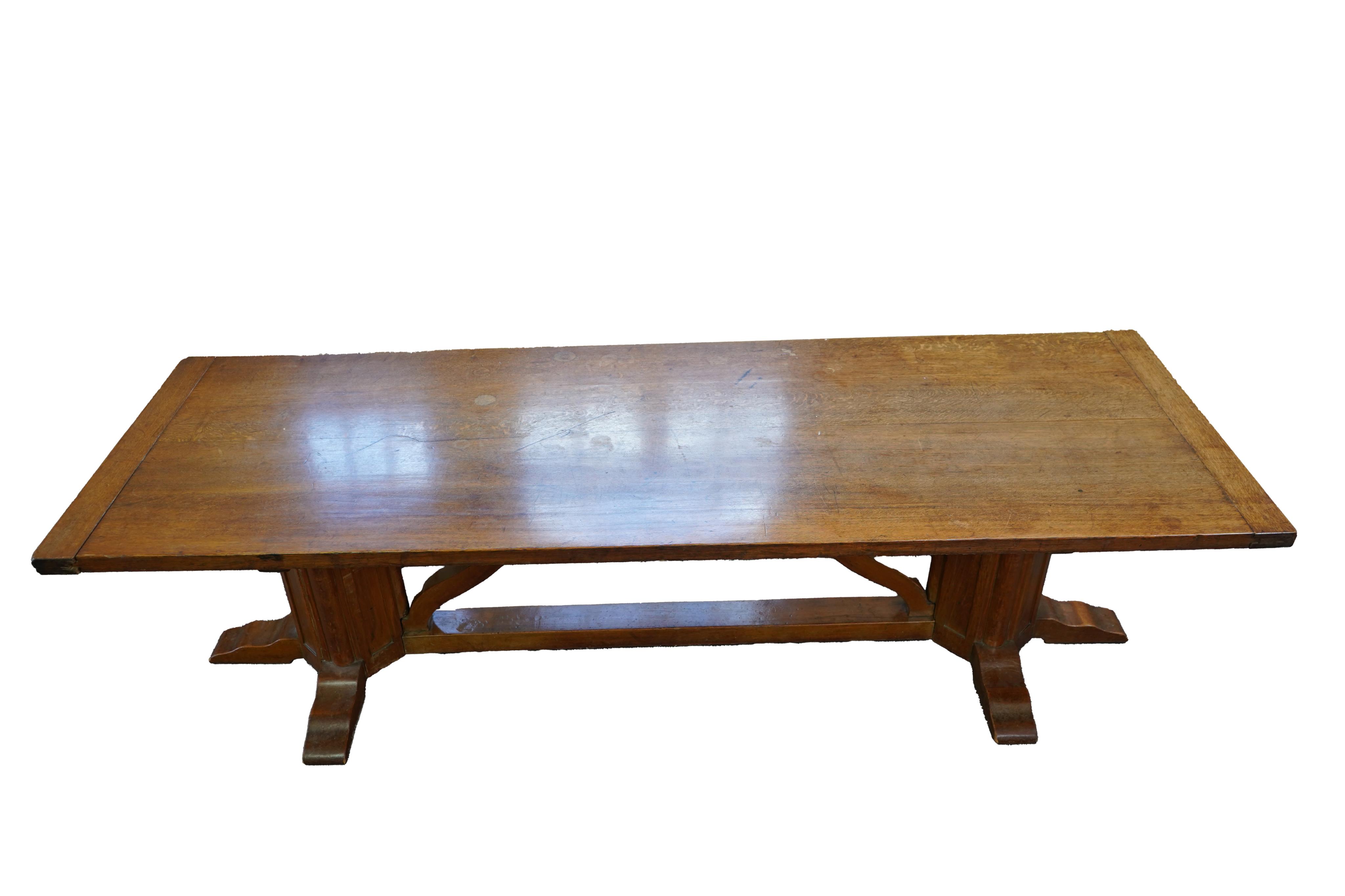 An Arts and Crafts oak refectory dining table
